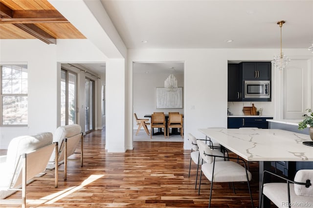 dining room with a chandelier and dark wood-type flooring