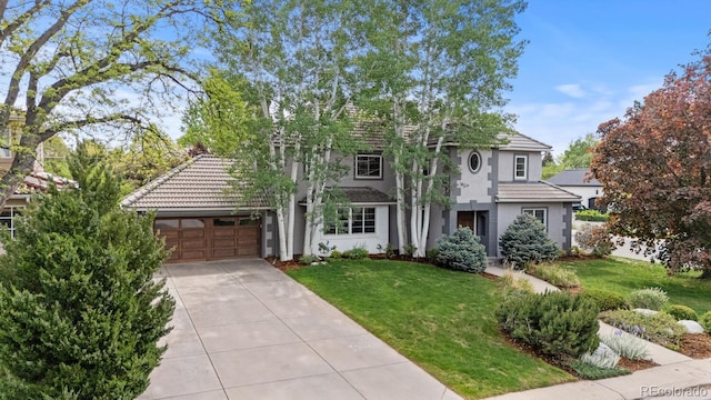 172 S Forest St, Denver, CO 80246 - view of front of home featuring driveway, stucco siding, a front yard, and a tiled roof