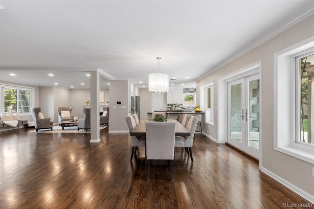 172 S Forest St, Denver, CO 80246 - dining space featuring a chandelier, dark wood finished floors, recessed lighting, french doors, and crown molding