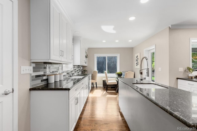 172 S Forest St, Denver, CO 80246 - kitchen featuring a sink, plenty of natural light, white cabinets, and recessed lighting