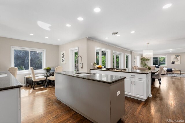 172 S Forest St, Denver, CO 80246 - kitchen featuring a sink, a kitchen island with sink, dark wood-style floors, white cabinetry, and recessed lighting