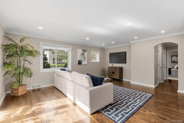 172 S Forest St, Denver, CO 80246 - living area featuring arched walkways, wood finished floors, baseboards, recessed lighting, and ornamental molding