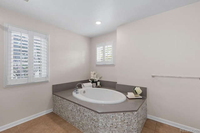 172 S Forest St, Denver, CO 80246 - bathroom with tile patterned floors, baseboards, and a bath