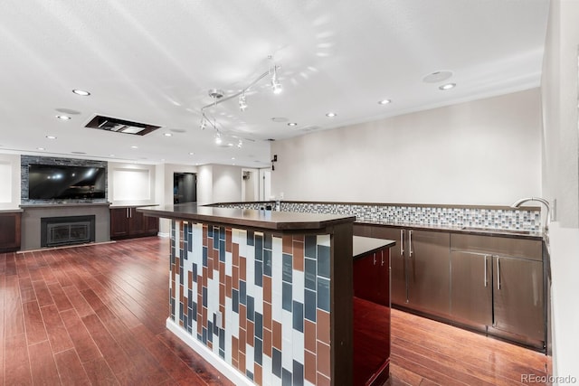 172 S Forest St, Denver, CO 80246 - bar with a sink, wood finished floors, a fireplace, and recessed lighting