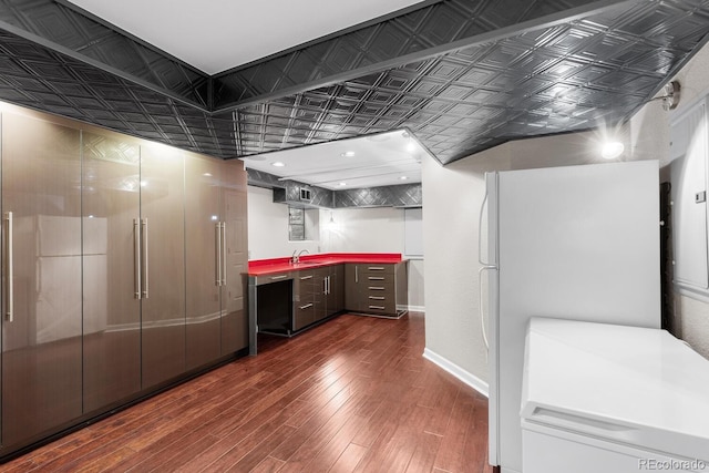 172 S Forest St, Denver, CO 80246 - bathroom with an ornate ceiling, a sink, wood finished floors, and baseboards