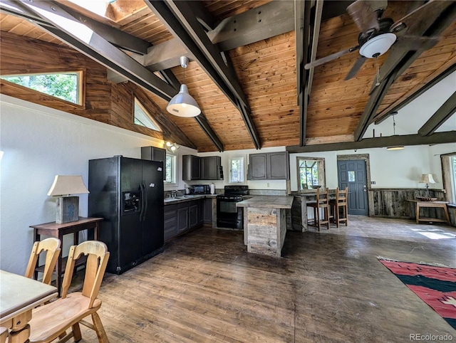 kitchen featuring ceiling fan, wooden ceiling, beam ceiling, dark hardwood / wood-style floors, and black appliances