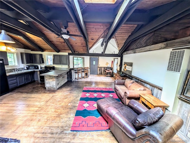 view of patio / terrace with an outdoor kitchen, sink, and ceiling fan