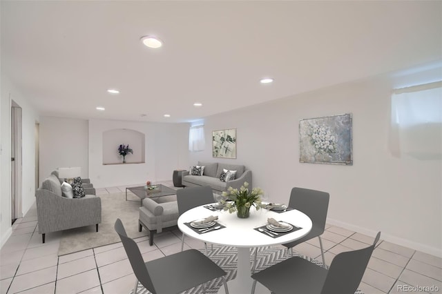 dining space featuring light tile patterned flooring