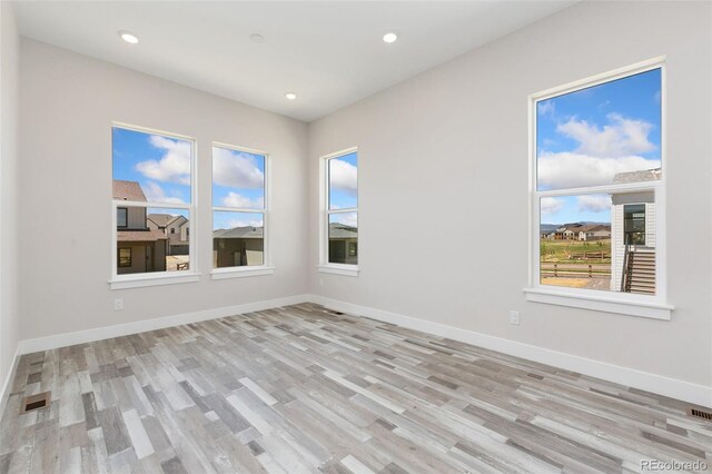 5835 Gianna Dr, Timnath, CO 80547 - unfurnished room with wood finished floors, baseboards, and recessed lighting