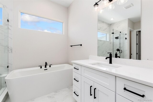 5835 Gianna Dr, Timnath, CO 80547 - bathroom featuring marble finish floors, plenty of natural light, a marble finish shower, and vanity