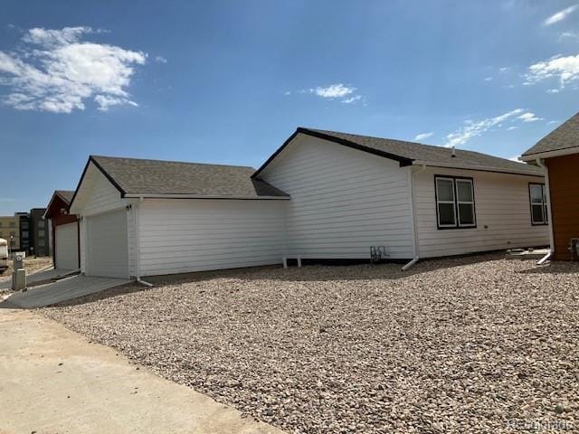 view of home's exterior with an attached garage