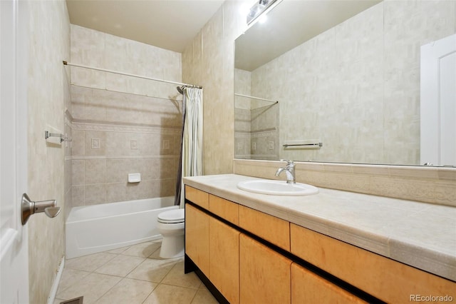 full bathroom featuring vanity, toilet, tile patterned floors, and shower / bathtub combination with curtain