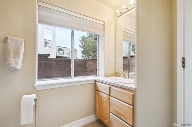 bathroom with vanity and a healthy amount of sunlight