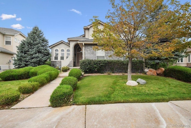 view of front of home with a front yard