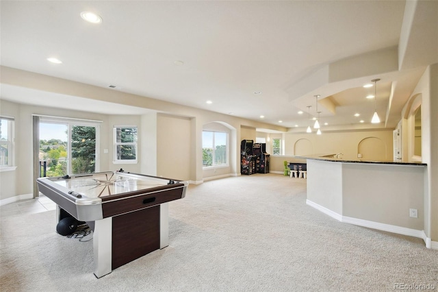 playroom with billiards, light carpet, and a healthy amount of sunlight