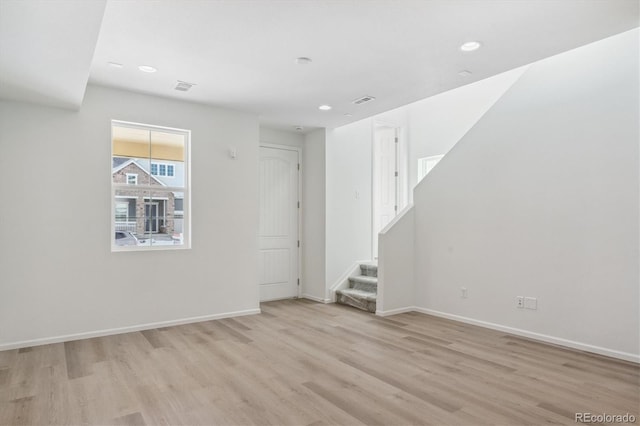 unfurnished room with light hardwood / wood-style flooring