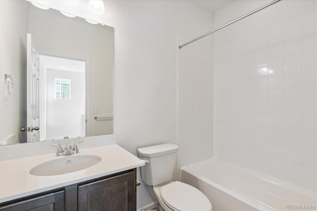 full bathroom featuring vanity, toilet, and tiled shower / bath combo