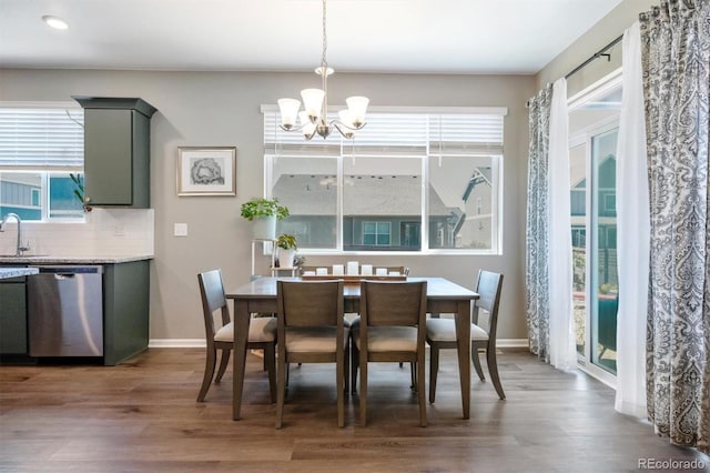 27130 E Maple Ave, Aurora, CO 80018 - dining room featuring a chandelier, wood finished floors, baseboards, and recessed lighting