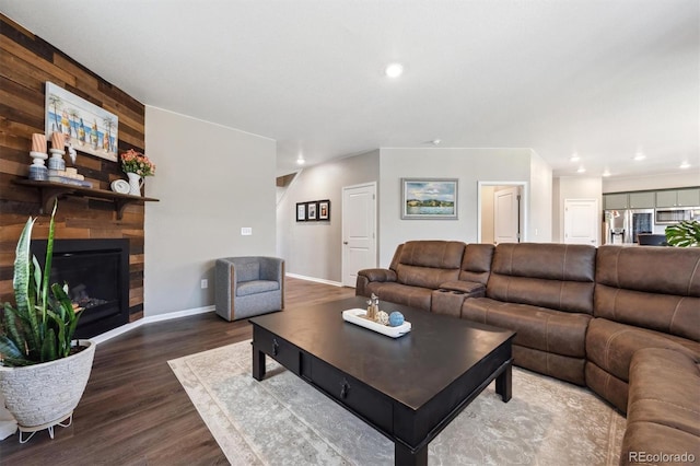 27130 E Maple Ave, Aurora, CO 80018 - living area with wood finished floors, recessed lighting, baseboards, and a fireplace