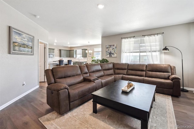 27130 E Maple Ave, Aurora, CO 80018 - living area with wood finished floors and baseboards