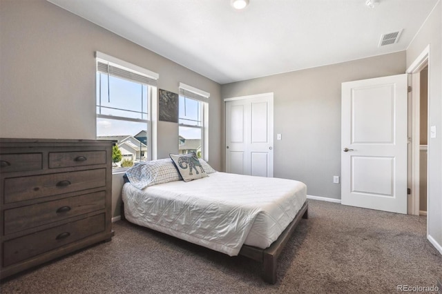 27130 E Maple Ave, Aurora, CO 80018 - bedroom featuring dark colored carpet, baseboards, and a closet