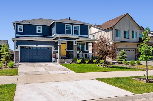 27130 E Maple Ave, Aurora, CO 80018 - view of front facade featuring an attached garage, driveway, board and batten siding, a front lawn, and a porch