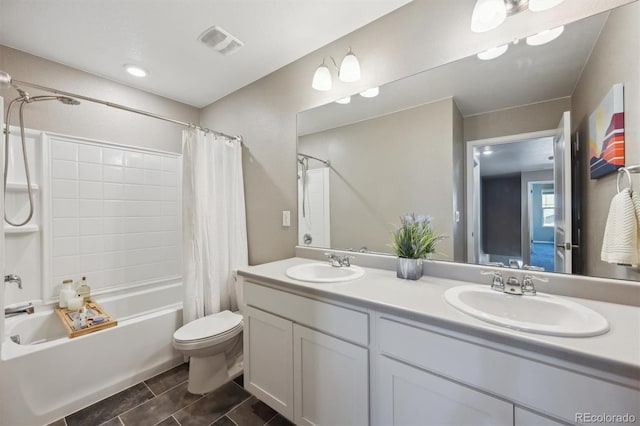 27130 E Maple Ave, Aurora, CO 80018 - bathroom with shower / bath combo with shower curtain, toilet, and double vanity