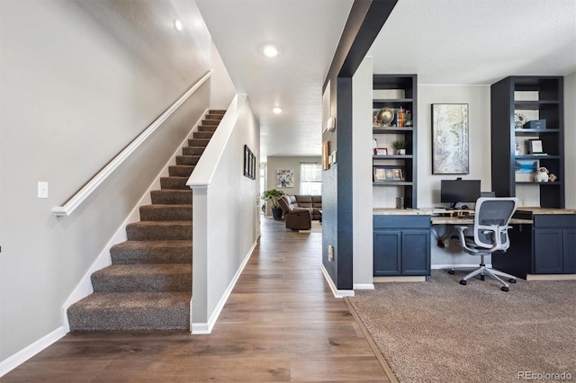 27130 E Maple Ave, Aurora, CO 80018 - office area with built in desk, wood finished floors, baseboards, a textured ceiling, and recessed lighting