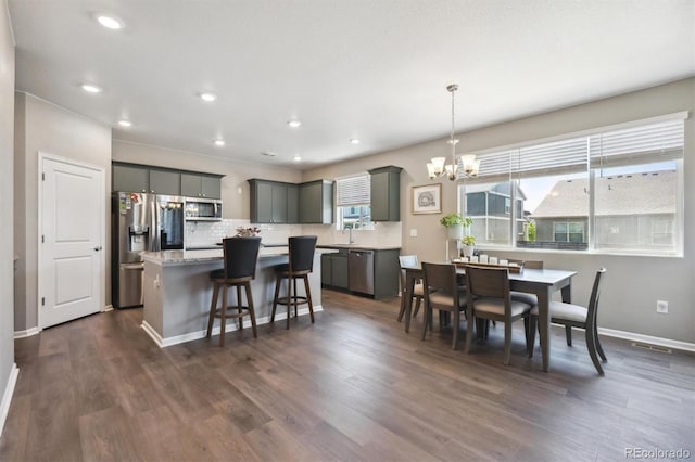 27130 E Maple Ave, Aurora, CO 80018 - dining area with a chandelier, dark wood-style flooring, baseboards, and recessed lighting