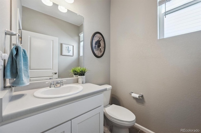 27130 E Maple Ave, Aurora, CO 80018 - half bathroom featuring vanity and toilet