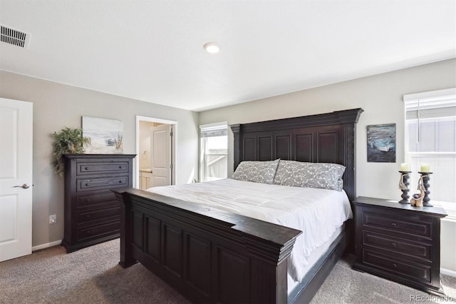 27130 E Maple Ave, Aurora, CO 80018 - carpeted bedroom with baseboards and connected bathroom