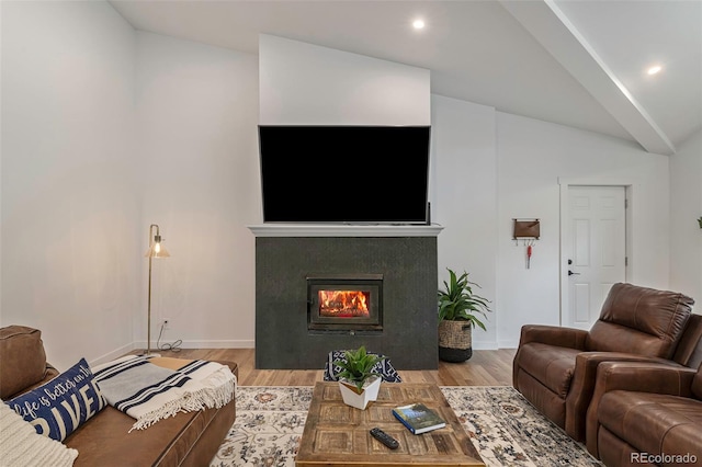 living room featuring light hardwood / wood-style flooring and vaulted ceiling