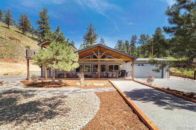 view of front of home with a porch and a garage