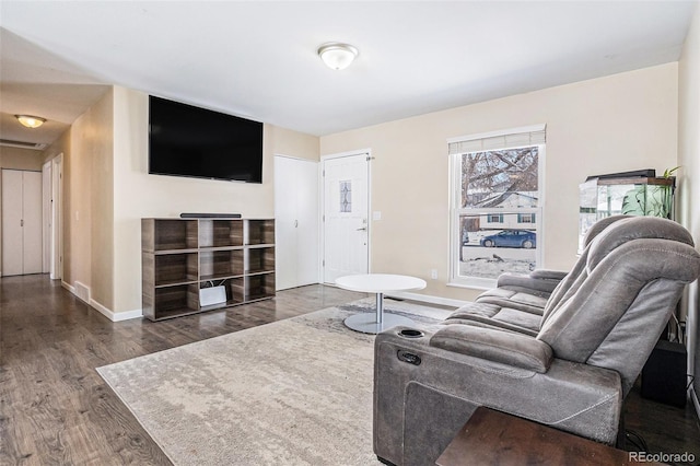 living room with dark hardwood / wood-style floors