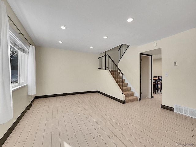 spare room featuring light wood-type flooring