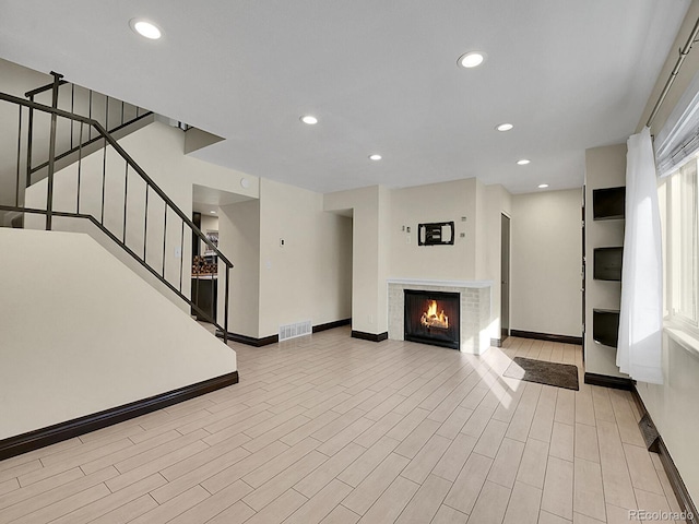 unfurnished living room featuring light wood-type flooring