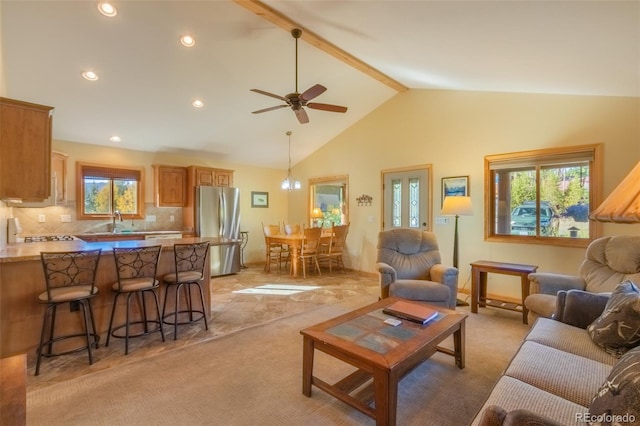 carpeted living room featuring beamed ceiling, ceiling fan, and high vaulted ceiling