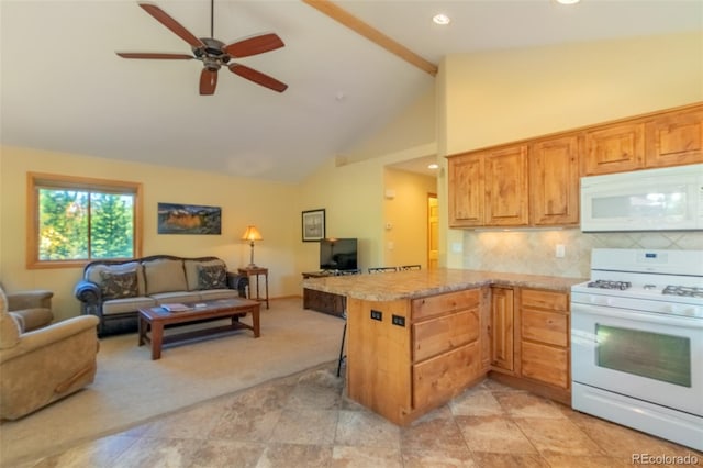 kitchen featuring tasteful backsplash, a breakfast bar area, light colored carpet, kitchen peninsula, and white appliances