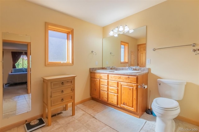 bathroom with tile patterned floors, vanity, and toilet