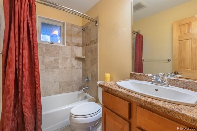 full bathroom with vanity, toilet, and shower / bath combo