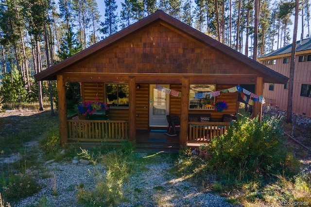 view of outbuilding with covered porch