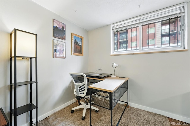 office space featuring baseboards and carpet
