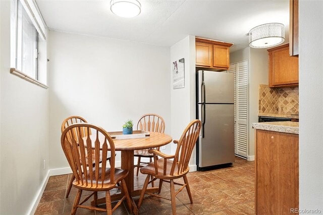 dining room featuring baseboards