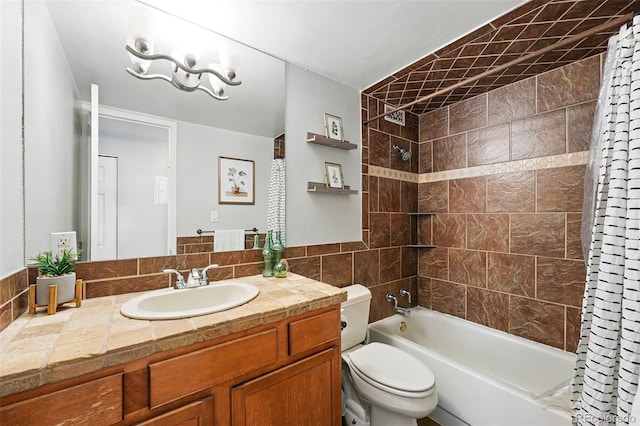 full bath featuring toilet, shower / bathtub combination with curtain, and vanity