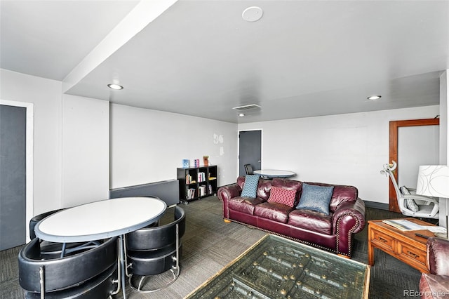 living area with carpet and recessed lighting