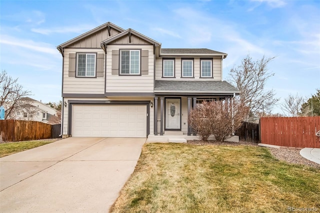 view of front of property featuring a garage and a front lawn