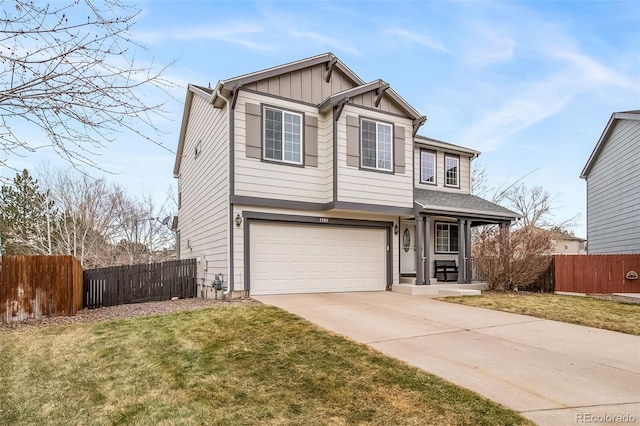 view of front of house with a garage and a front lawn