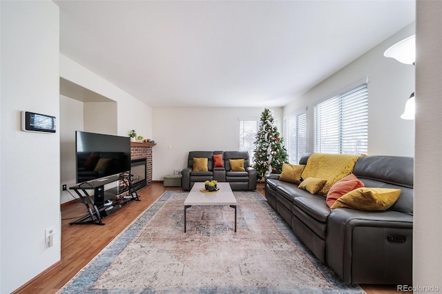 living room featuring hardwood / wood-style flooring and a fireplace