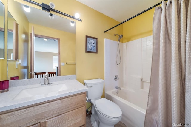 full bathroom with shower / bath combo with shower curtain, vanity, and toilet