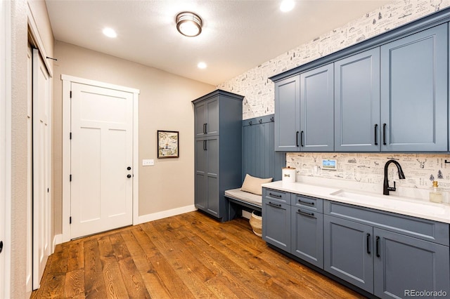 31455 Half Peak Trl, Pine, CO 80470 - kitchen with a sink, dark wood finished floors, light countertops, baseboards, and recessed lighting
